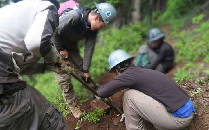 teens work on service project on outward bound expedition